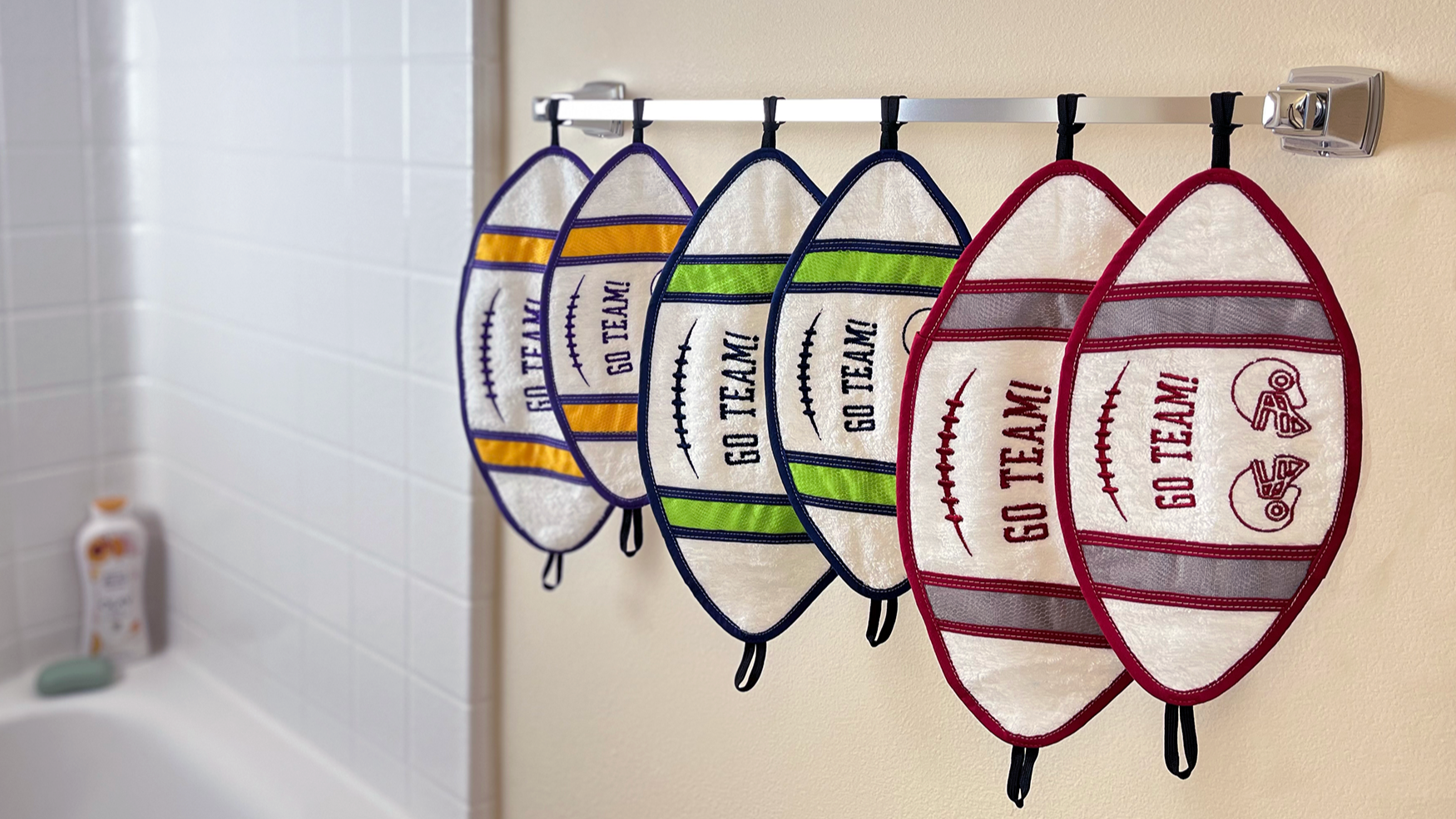Football towels hanging on a shower rack